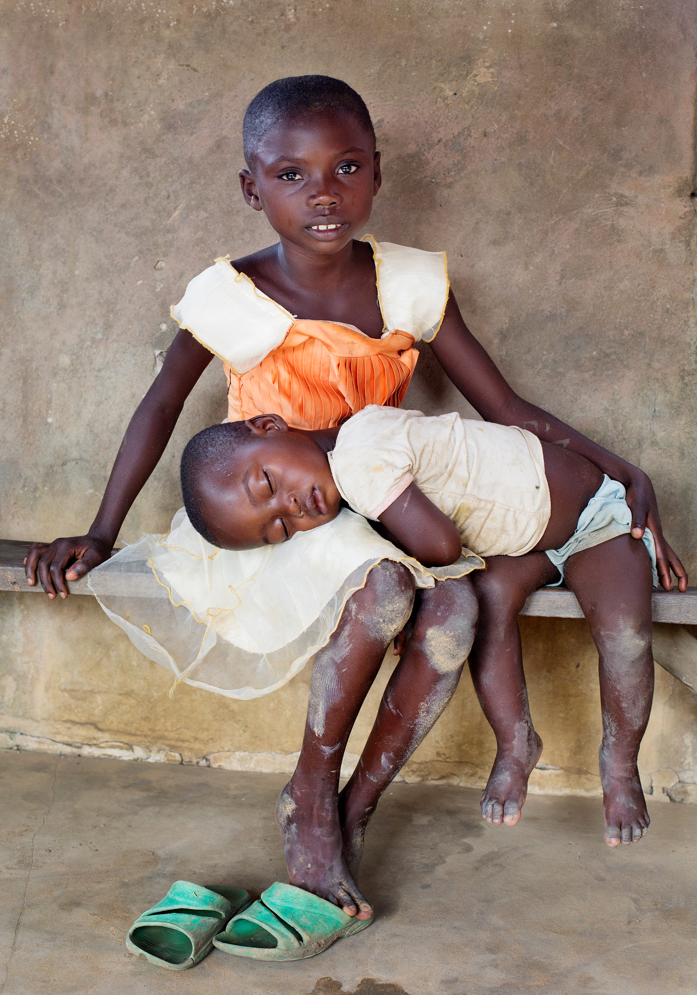 Sisters half naked balck man sitting with a flower in his hand